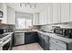 Kitchen featuring modern appliances, two-tone cabinets and updated countertops at 5004 Cannon Blvd, Las Vegas, NV 89108