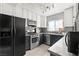 Galley-style kitchen with stainless steel appliances and dark-lower & white-upper cabinets at 5004 Cannon Blvd, Las Vegas, NV 89108