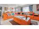 This well-lit living room features a stylish orange sectional sofa and decor at 5004 Cannon Blvd, Las Vegas, NV 89108