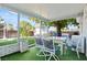 Covered patio with dining set and lush green backyard at 5004 Cannon Blvd, Las Vegas, NV 89108