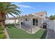A private backyard with a covered patio and a barbeque at 509 Regal Robin Way, North Las Vegas, NV 89084