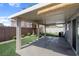 A charming covered patio with lush artificial grass, perfect for outdoor gatherings at 509 Regal Robin Way, North Las Vegas, NV 89084