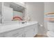This bathroom features a rainbow design with a single sink vanity and comfort height toilet at 509 Regal Robin Way, North Las Vegas, NV 89084