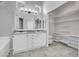 Modern bathroom features double vanity, sleek fixtures, and a linen closet for ample storage at 509 Regal Robin Way, North Las Vegas, NV 89084