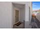 Covered front entry with a screen door and a 'hello' welcome mat in a home with textured walls at 509 Regal Robin Way, North Las Vegas, NV 89084