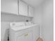 An efficient laundry area equipped with a modern, front-loading washer and dryer set at 509 Regal Robin Way, North Las Vegas, NV 89084