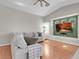 Cozy living room features plush seating, a built-in entertainment center, and sleek hardwood floors at 509 Regal Robin Way, North Las Vegas, NV 89084