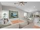 Open concept living area with a large TV, comfortable seating, and a seamless transition to the dining and kitchen areas at 509 Regal Robin Way, North Las Vegas, NV 89084