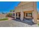 Covered patio area with seating offering views of the landscaped backyard at 5237 Crooked Sky Cir, Las Vegas, NV 89149
