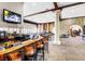 Stylish bar area with ample seating, stone accents, and multiple televisions for entertainment at 5237 Crooked Sky Cir, Las Vegas, NV 89149
