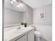 Bathroom featuring a white vanity, large mirror, and neutral gray walls at 5237 Crooked Sky Cir, Las Vegas, NV 89149