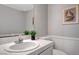 Bathroom featuring a white vanity, a large mirror, and neutral gray walls with decor at 5237 Crooked Sky Cir, Las Vegas, NV 89149