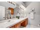 The bathroom features a large vanity with dual sinks and a glass enclosed shower at 5237 Crooked Sky Cir, Las Vegas, NV 89149