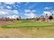 Picturesque golf course view with lush green fairways, sand traps, and clear blue skies, ideal for golf enthusiasts at 5237 Crooked Sky Cir, Las Vegas, NV 89149