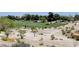 Expansive golf course showcasing its beautifully maintained greens and natural desert landscaping, provides a serene backdrop at 5237 Crooked Sky Cir, Las Vegas, NV 89149