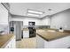 Spacious kitchen featuring tile floors, white cabinets and stainless steel appliances at 5237 Crooked Sky Cir, Las Vegas, NV 89149