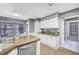 Updated kitchen with stainless steel appliances and an adjacent eat-in area at 5237 Crooked Sky Cir, Las Vegas, NV 89149