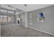 Bright living room with vaulted ceilings, a fireplace, and large windows offering natural light at 5237 Crooked Sky Cir, Las Vegas, NV 89149