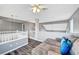 Upper level loft space with railing, plush seating, and an open airy floor plan at 5237 Crooked Sky Cir, Las Vegas, NV 89149