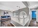 Comfortable loft space showcasing stylish decor, an arched window, and modern flooring at 5237 Crooked Sky Cir, Las Vegas, NV 89149