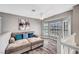 Cozy loft area with plush seating, a ceiling fan, natural light, and sleek flooring at 5237 Crooked Sky Cir, Las Vegas, NV 89149