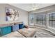 Comfortable loft featuring plush seating with accent pillows, modern flooring, and natural light at 5237 Crooked Sky Cir, Las Vegas, NV 89149