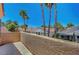 Outdoor patio with stucco walls offers views of the surrounding neighborhood and palm trees at 5237 Crooked Sky Cir, Las Vegas, NV 89149