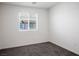 This bedroom features neutral carpet, white walls, and a window providing natural light at 532 Clearsable Ave, Henderson, NV 89044