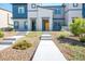Charming townhome with inviting yellow front door and low-maintenance desert landscaping at 532 Clearsable Ave, Henderson, NV 89044