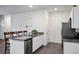 Modern kitchen with stainless steel appliances, granite countertops, and a breakfast bar at 532 Clearsable Ave, Henderson, NV 89044