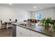 Modern kitchen with granite countertops, stainless appliances, and an open concept design at 532 Clearsable Ave, Henderson, NV 89044