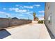 Spacious backyard featuring a concrete patio, block wall fencing and blue skies in a desert landscape at 5336 Regal Ave, Las Vegas, NV 89146