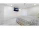 This bedroom is bright and features a television and a door at 5336 Regal Ave, Las Vegas, NV 89146