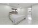 Clean bedroom features a queen bed with light colored linens and a window view at 5336 Regal Ave, Las Vegas, NV 89146