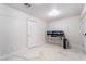 Bright bedroom with desk and monitors set on modern tiling at 5336 Regal Ave, Las Vegas, NV 89146