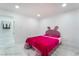 Cozy bedroom designed for a , furnished with a comfortable pink bed, set on a tiled floor at 5336 Regal Ave, Las Vegas, NV 89146