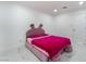 Cozy bedroom designed for a , furnished with a comfortable pink bed, set on a tiled floor at 5336 Regal Ave, Las Vegas, NV 89146