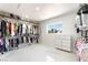 Large walk-in closet featuring ample storage space with clothing racks and built-in shelving at 5336 Regal Ave, Las Vegas, NV 89146