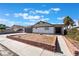 Traditional home featuring an attached garage, palm trees, and front yard at 5336 Regal Ave, Las Vegas, NV 89146