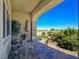 Inviting front porch with stone columns and decorative furniture, perfect for relaxing outdoors at 5500 Santovito St, Pahrump, NV 89061