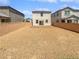 Spacious backyard with gravel landscaping and privacy walls, offering a blank canvas for outdoor customization at 5709 Jaysin Douglas St, North Las Vegas, NV 89031