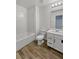 Full bathroom offers a tiled shower and single sink vanity at 5709 Jaysin Douglas St, North Las Vegas, NV 89031