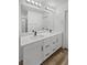 Bathroom featuring a double vanity with modern fixtures and hardware at 5709 Jaysin Douglas St, North Las Vegas, NV 89031