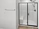Modern bathroom with black-framed shower and built-in bench at 5709 Jaysin Douglas St, North Las Vegas, NV 89031
