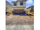 Two-story home with a two-car garage and paved driveway at 5709 Jaysin Douglas St, North Las Vegas, NV 89031