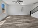 Bright living room with neutral walls, ceiling fan, and attractive wood-look floors at 5709 Jaysin Douglas St, North Las Vegas, NV 89031
