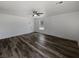Bright living room featuring modern ceiling fan, sleek floors, and a minimalist aesthetic at 5709 Jaysin Douglas St, North Las Vegas, NV 89031