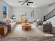 Bright living room featuring stylish furnishings, neutral tones, and plenty of natural light at 5709 Jaysin Douglas St, North Las Vegas, NV 89031