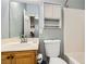 Bathroom featuring a wooden vanity, mirror, toilet, and a shower-tub combination at 6321 Rolling Rose St # 201, North Las Vegas, NV 89081