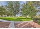 A grassy community park featuring walking paths and mature trees at 6321 Rolling Rose St # 201, North Las Vegas, NV 89081